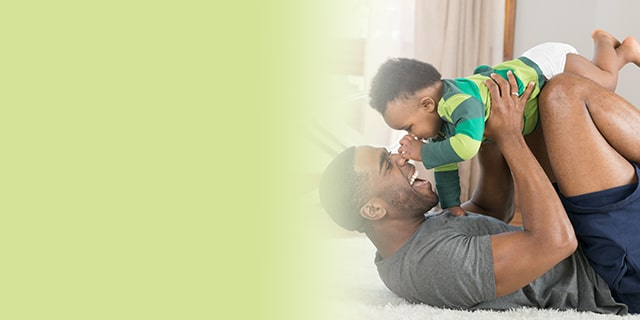 Dad and baby playing