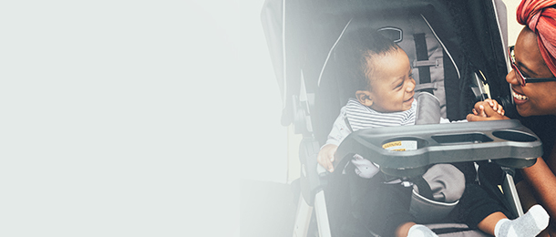 Mom chatting to her baby in a stroller