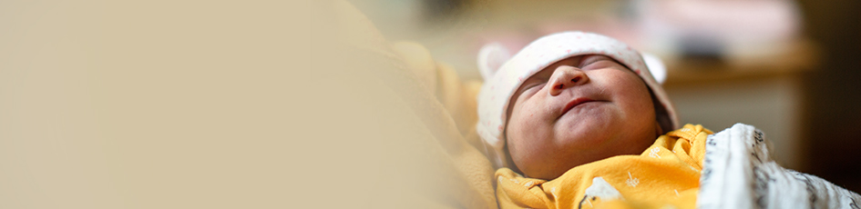 Newborn baby in mom's arms
