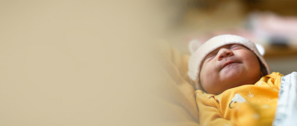 Newborn baby in mom's arms