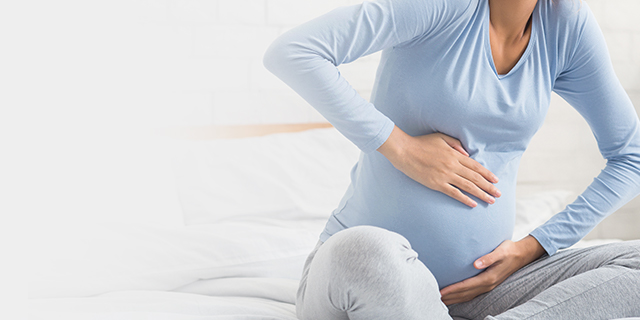Woman experiencing signs of labour